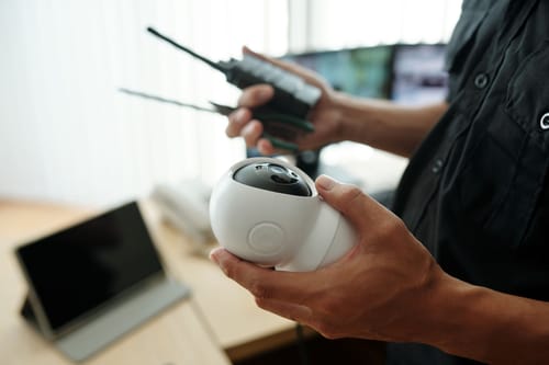 off grid security camera rv in the hands of a boondocker setting up his remote system